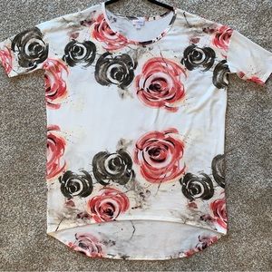 LuLaRoe Irma tunic in size L in white, black and shades of pink.